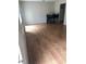 Open-concept dining area featuring wood floors and adjacent kitchen at 1151 Rankin St # 21A, Stone Mountain, GA 30083
