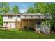This exterior view showcases the two-story house and backyard with a deck at 185 Hickory View Dr, Lawrenceville, GA 30046