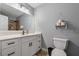 Well-lit bathroom featuring modern fixtures, stylish vanity, and a wall-mounted toilet paper holder at 185 Hickory View Dr, Lawrenceville, GA 30046