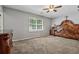 Spacious bedroom with a ceiling fan, window and an ornate bed frame at 185 Hickory View Dr, Lawrenceville, GA 30046