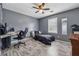 Bedroom with ceiling fan, window views, wood floors, and furniture, perfect for relaxation at 185 Hickory View Dr, Lawrenceville, GA 30046