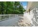 This is a view of the wooden deck of a two-story house with a white railing at 185 Hickory View Dr, Lawrenceville, GA 30046