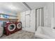 Laundry area with a washer and dryer and storage space, with a wash basin to the side at 185 Hickory View Dr, Lawrenceville, GA 30046