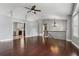 Open living room and kitchen with hardwood floors and modern light fixture at 185 Hickory View Dr, Lawrenceville, GA 30046