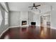Spacious living room with brick fireplace, hardwood floors, and abundant light at 185 Hickory View Dr, Lawrenceville, GA 30046