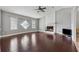 Open living room with hardwood floors, fireplace, and vaulted ceilings at 185 Hickory View Dr, Lawrenceville, GA 30046