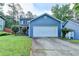 Charming two-story home with a well-manicured lawn and a two car garage in a desirable neighborhood at 200 Mona Ct, Lawrenceville, GA 30044