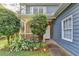 Charming front porch with brick accents, landscaping and a small seating area at 200 Mona Ct, Lawrenceville, GA 30044