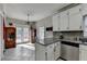 Bright kitchen featuring granite countertops, stainless steel appliances, and ample counter space at 200 Mona Ct, Lawrenceville, GA 30044