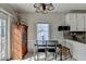 Eat-in kitchen offers a breakfast bar, white cabinets, and a window for natural light at 200 Mona Ct, Lawrenceville, GA 30044