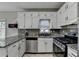 Well-equipped kitchen with granite countertops, stainless steel appliances, and ample cabinet space at 200 Mona Ct, Lawrenceville, GA 30044