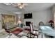 Inviting living room featuring a fireplace, plush seating, and a ceiling fan for optimal comfort at 200 Mona Ct, Lawrenceville, GA 30044