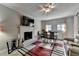 Cozy living room with a fireplace, TV, dining table, and comfortable seating, perfect for relaxation at 200 Mona Ct, Lawrenceville, GA 30044