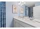 Stylish bathroom featuring double sinks, ample counter space, and trendy wallpaper at 2545 Dixon Pl, Lawrenceville, GA 30045