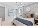 Chic bedroom with blue accents, stylish lighting, and decorative wallpaper at 2545 Dixon Pl, Lawrenceville, GA 30045