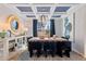 Elegant dining room with coffered ceilings, wood floors, and modern chandelier at 2545 Dixon Pl, Lawrenceville, GA 30045