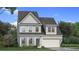 Charming two-story home showcasing stone and siding exterior, complemented by a well-manicured lawn at 2545 Dixon Pl, Lawrenceville, GA 30045