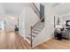 Inviting foyer with wood staircase, leading to living areas and bedrooms at 2545 Dixon Pl, Lawrenceville, GA 30045
