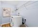 Practical laundry room with washer, dryer, and storage shelves at 2545 Dixon Pl, Lawrenceville, GA 30045
