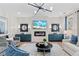 Elegant living room with modern fireplace, art, and comfortable seating at 2545 Dixon Pl, Lawrenceville, GA 30045