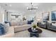 Open-concept living room view, connecting to the kitchen and dining area, with lots of space for gatherings at 2545 Dixon Pl, Lawrenceville, GA 30045