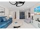 Cozy living room with a blue sectional, decorative wallpaper, and stylish furnishings at 2545 Dixon Pl, Lawrenceville, GA 30045