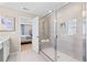 Large glass enclosed shower with tile surround, bench, and recessed shelves at 2545 Dixon Pl, Lawrenceville, GA 30045