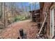 Backyard featuring mature trees, a screened in deck, and foliage at 5843 Foxfield Trl, Rex, GA 30273