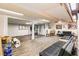 Spacious basement with wood flooring and a lounge area with dark leather couches at 5843 Foxfield Trl, Rex, GA 30273