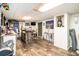 Finished basement with wood-look flooring, bar with stools, and accent lighting at 5843 Foxfield Trl, Rex, GA 30273