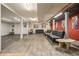 Spacious basement featuring new floors, comfortable seating, and vibrant wall art for a perfect entertaining space at 5843 Foxfield Trl, Rex, GA 30273