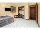 Cozy bedroom with closet and en-suite access; TV included at 5843 Foxfield Trl, Rex, GA 30273