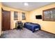 A modest bedroom with a small desk at 5843 Foxfield Trl, Rex, GA 30273