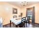 Bright dining room featuring a modern table and chairs, perfect for Gathering gatherings and entertaining guests at 5843 Foxfield Trl, Rex, GA 30273