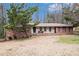 Charming brick home with a well-maintained yard and mature tree in a peaceful, established neighborhood at 5843 Foxfield Trl, Rex, GA 30273
