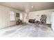 Spacious garage with a roll up door, refrigerator, and lots of storage at 5843 Foxfield Trl, Rex, GA 30273