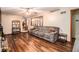 Comfortable living room with hardwood floors, neutral decor, and ample seating at 5843 Foxfield Trl, Rex, GA 30273
