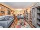 Spacious living area with hardwood floors, large windows, and modern decor for comfortable living at 5843 Foxfield Trl, Rex, GA 30273