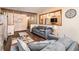 Open concept living room with hardwood floors, stylish furniture, and an airy ambiance at 5843 Foxfield Trl, Rex, GA 30273