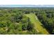 Aerial view showcasing the golf course and lush greenery surrounding the property at 1323 Frey Lake Ct, Kennesaw, GA 30144