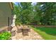 Outdoor patio features a dining table, lounging chairs, and a hammock for relaxing outdoors at 1323 Frey Lake Ct, Kennesaw, GA 30144