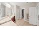 Bright bathroom features double sinks with a vanity and large mirrors at 1323 Frey Lake Ct, Kennesaw, GA 30144