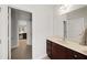 Bathroom features a single sink vanity with marble countertops, wood cabinets, and a view of secondary bathroom at 1323 Frey Lake Ct, Kennesaw, GA 30144