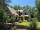 Charming home exterior with lush landscaping, manicured lawn, and inviting curb appeal at 1323 Frey Lake Ct, Kennesaw, GA 30144