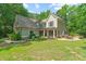 Charming home with lush lawn and well-manicured landscaping at 1323 Frey Lake Ct, Kennesaw, GA 30144