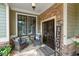 Inviting front porch with stone accents, comfortable seating, and welcoming decor at 1323 Frey Lake Ct, Kennesaw, GA 30144
