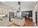 Open concept kitchen with island and stainless steel appliances at 1323 Frey Lake Ct, Kennesaw, GA 30144