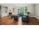 Bright living room with fireplace and large windows provides an abundance of natural light at 1323 Frey Lake Ct, Kennesaw, GA 30144