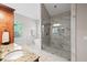 Main bathroom showcasing dual shower heads, marble tile, granite vanity and a soaking tub at 1323 Frey Lake Ct, Kennesaw, GA 30144