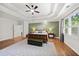 Spacious main bedroom with tray ceiling, hardwood floors, and natural light at 1323 Frey Lake Ct, Kennesaw, GA 30144